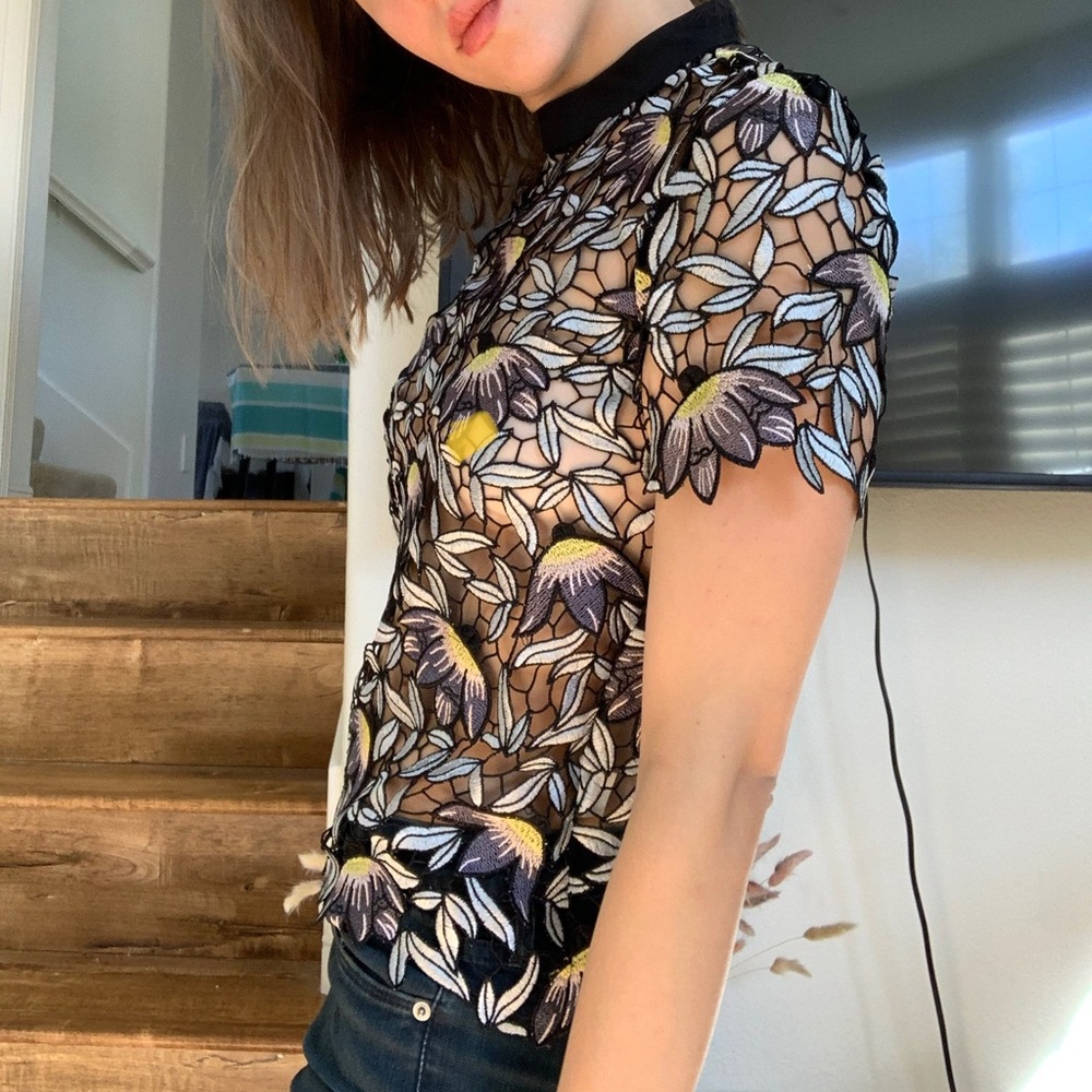 Beautiful see through embroidered t shirt.